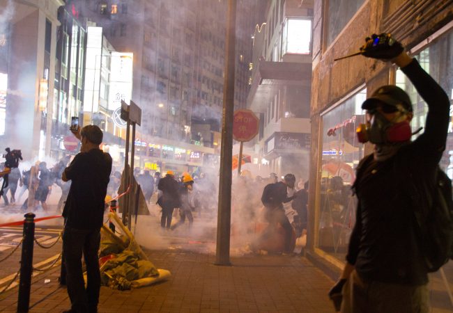 Photo by LT Chan: https://www.pexels.com/photo/man-wearing-gas-mask-standing-beside-store-facade-2833366/