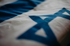 Photo by cottonbro studio: https://www.pexels.com/photo/close-up-of-the-flag-of-israel-4033852/
