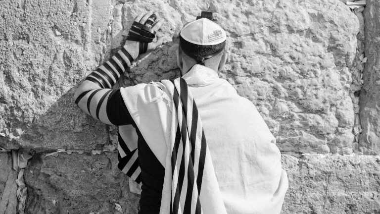 Photo by Marik Elikishvili: https://www.pexels.com/photo/anonymous-jewish-man-in-traditional-wear-praying-near-old-wall-4231037/