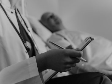 Photo by Tima Miroshnichenko: https://www.pexels.com/photo/doctor-holding-a-medical-chart-sitting-beside-a-patient-6010779/