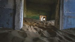 Photo by Francesco Ungaro: https://www.pexels.com/photo/a-room-with-sand-in-it-and-a-door-27907130/