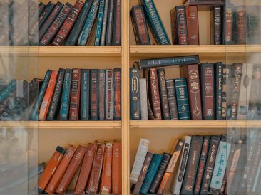 Photo by Toa Heftiba Şinca: https://www.pexels.com/photo/assorted-title-of-books-inside-brown-wooden-framed-glass-wall-mount-cabinet-1194399/