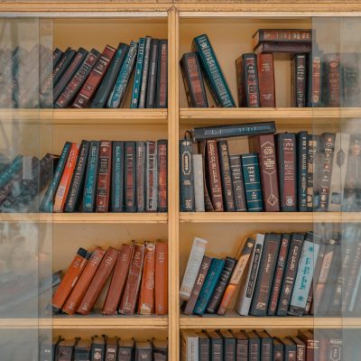 Photo by Toa Heftiba Şinca: https://www.pexels.com/photo/assorted-title-of-books-inside-brown-wooden-framed-glass-wall-mount-cabinet-1194399/