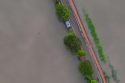 Photo by Raj Manohar: https://www.pexels.com/photo/aerial-view-of-flooded-road-surrounded-by-water-28428673/