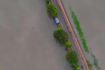 Photo by Raj Manohar: https://www.pexels.com/photo/aerial-view-of-flooded-road-surrounded-by-water-28428673/