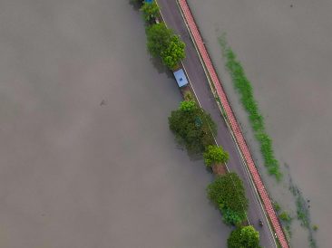 Photo by Raj Manohar: https://www.pexels.com/photo/aerial-view-of-flooded-road-surrounded-by-water-28428673/