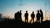 Photo by Afta Putta Gunawan: https://www.pexels.com/photo/silhouette-group-of-people-standing-on-grass-field-1250346/