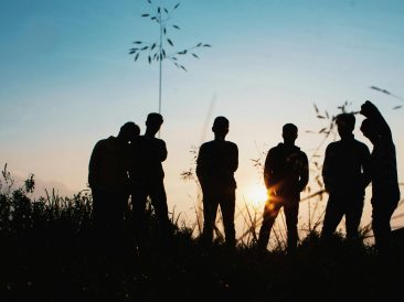 Photo by Afta Putta Gunawan: https://www.pexels.com/photo/silhouette-group-of-people-standing-on-grass-field-1250346/