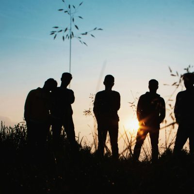 Photo by Afta Putta Gunawan: https://www.pexels.com/photo/silhouette-group-of-people-standing-on-grass-field-1250346/
